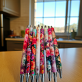 Set of Petite Gift Bundle - Stylish Bookmark and Pen Seton a kitchen counter
