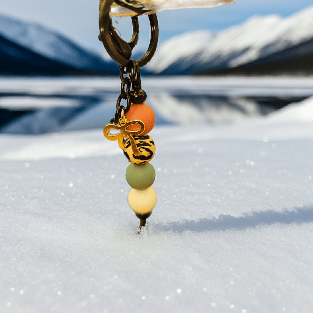 Introducing our stunning handmade gold bow charm keychain with colorful beads, a delightful accessory created with love and precision in polymer clay.