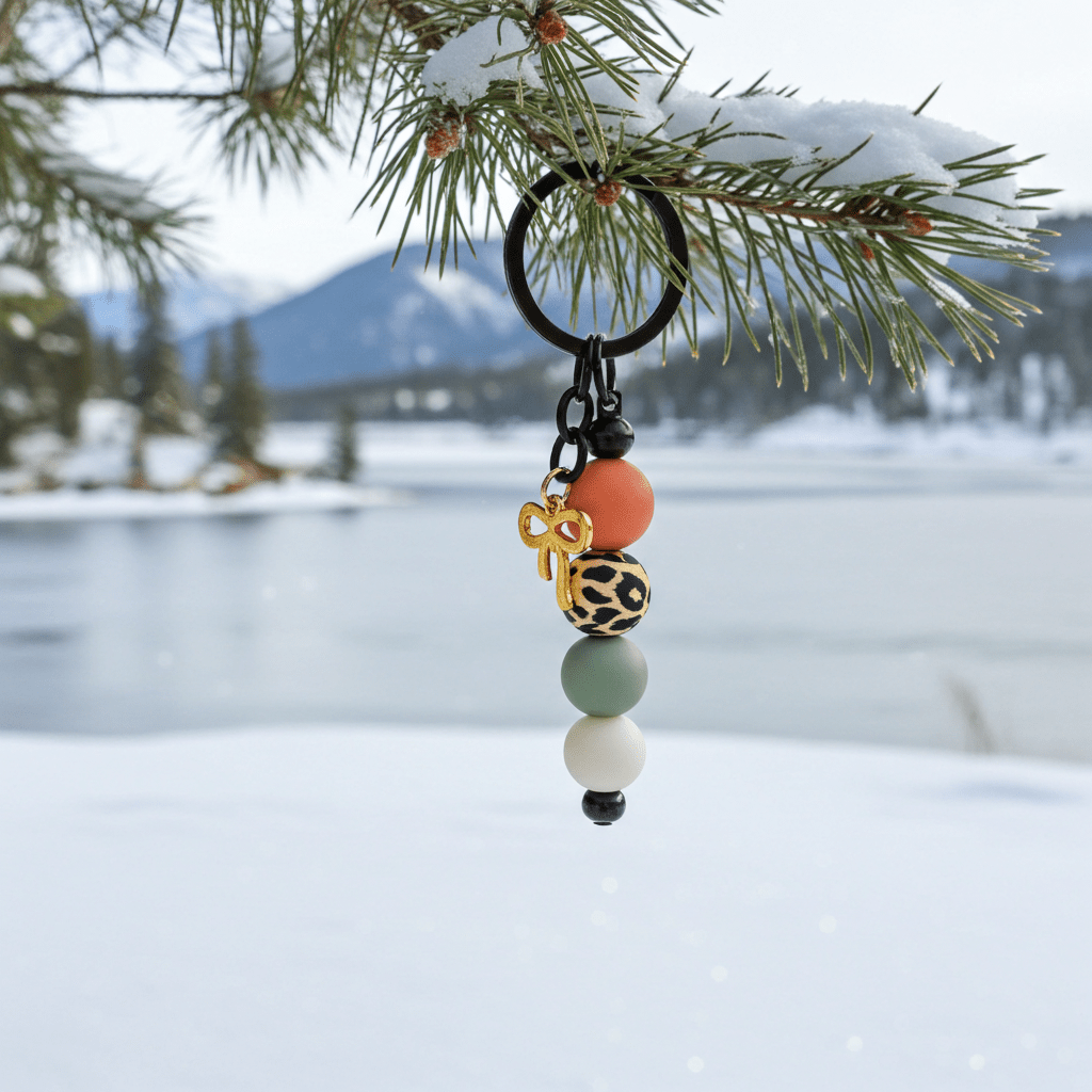 Our stunning handmade gold bow charm keychain with colorful beads, a delightful accessory created with love and precision in polymer clay.